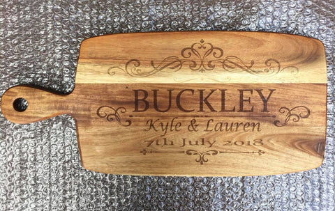 Wedding paddle board (acacia) featuring family name, couple's names and wedding date.